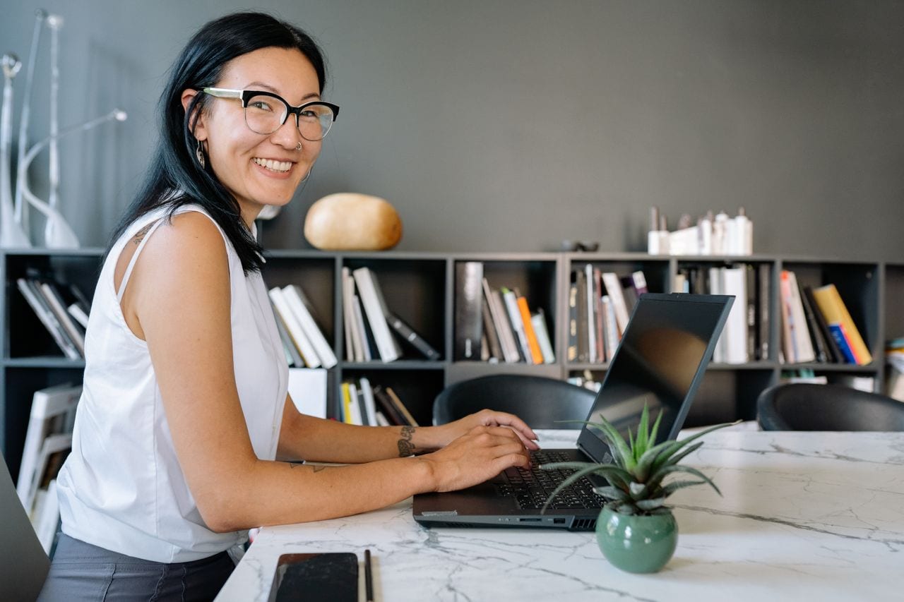 A professional at work in a modern, light-filled office space